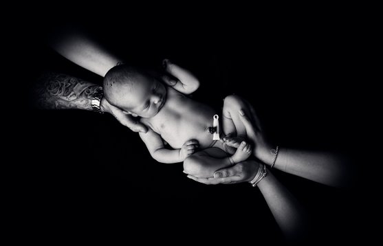 baby in hands black and white newborn portrait photography photographer hemel hempstead hertfordshire london