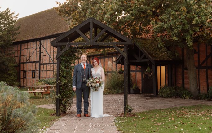 bride and groom outside the tithe barn bedford